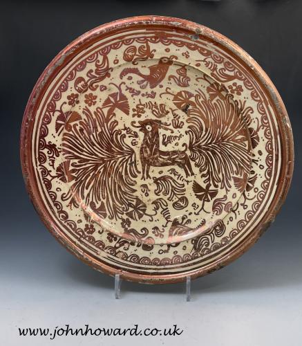 Hispano Moresque pottery deep sided charger with copper lustre decoration 17th century