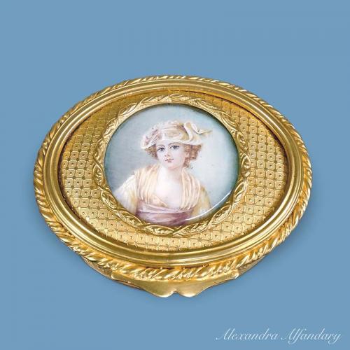 An Oval Gilt Metal Box With Painting of a Young Lady, circa 1900-1910