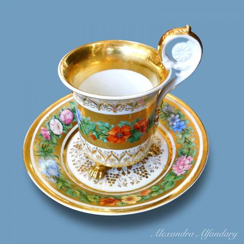 A German (Ilmenau) Porcelain Chocolate Cup and Saucer In The Empire Style, circa 1880