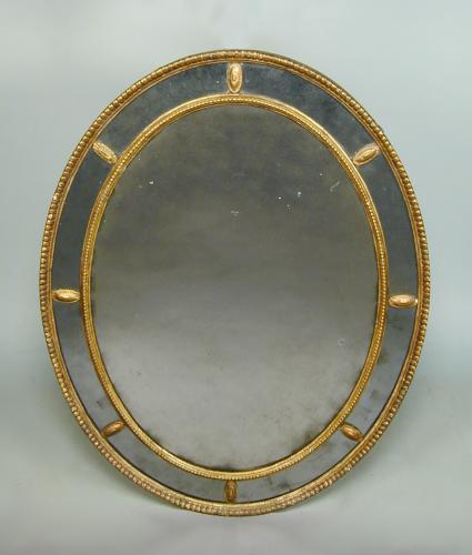 Adam period oval border glass mirror with original plates, c.1780