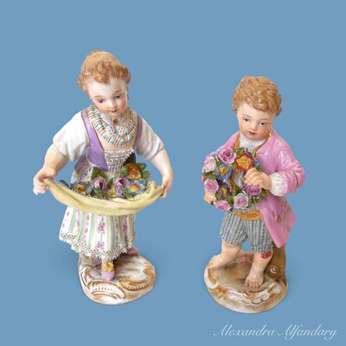 A Charming Pair Of Meissen Porcelain Figures Holding Flowers, circa 1870-1880