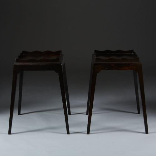 A Pair of Ebony Tables with Undulating Galleries