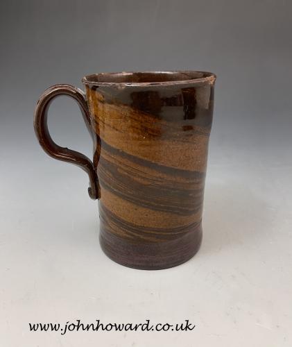 Early pottery agateware mug Staffordshire circa 1745 England