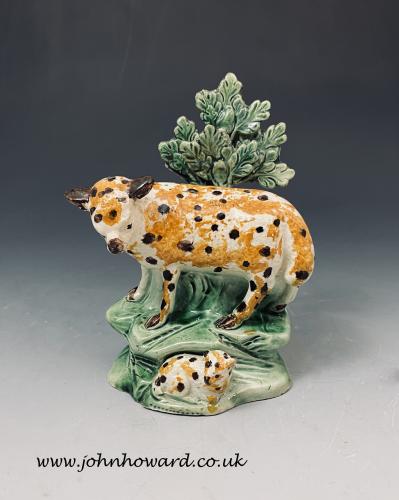 Staffordshire pottery early bocage figure of a spotted ewe and lamb circa 1800