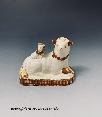 Antique English pottery figure of a lamb and lion from Bovey Tracey Pottery Devon circa 1815