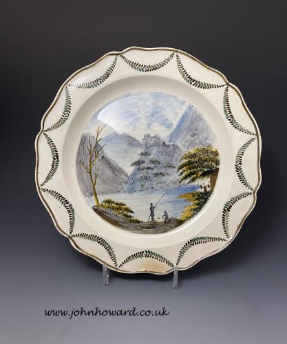 A Swansea Pottery pearlware charger decorated Pratt colours with view of Dolbadarn Castle circa 1800