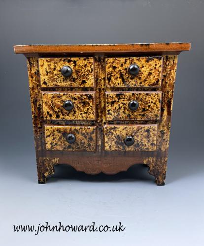 Slipware earthenware chest of drawers attributed to the Buckley Pottery and named and dated
