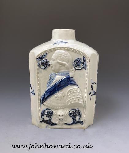 A fine pottery painted blue pearlware tea canister with profile of King George III late 18th century