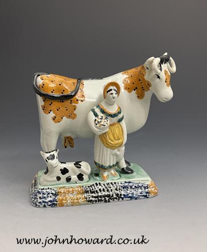 Yorkshire prattware figure of a cow and calf with a standing milk maid circa 1810