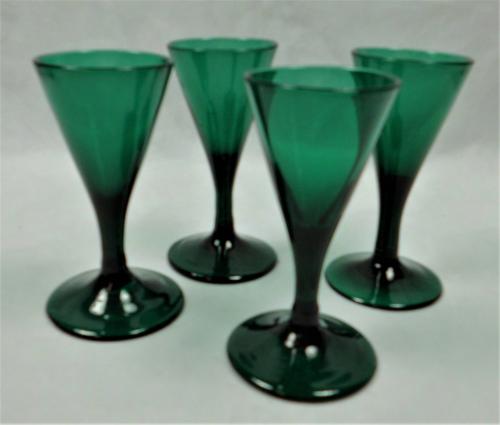 Four miniature trumpet shaped Bristol green glasses, English circa 1780.