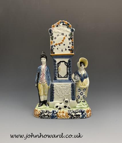 Yorkshire prattware pottery clock money box with soldier and maiden circa 1810