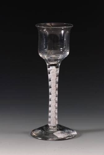 A wineglass, everted rim