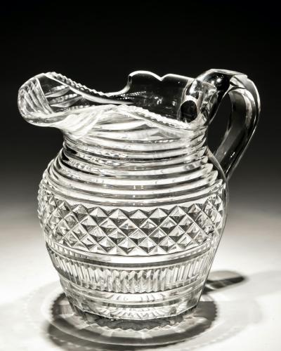 A diamond and step cut Regency jug