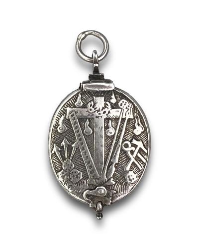 Silver reliquary locket with objects of the passion. French, 17th century