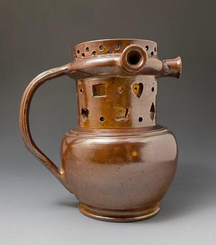 English brown stoneware puzzle jug of robust form, Late 18th century