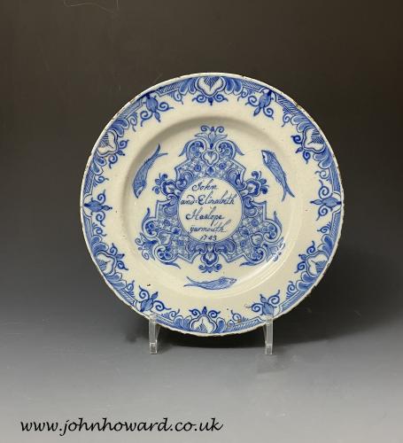 Delft pottery plate named and dated John and Elizabeth Haslope Yarmouth 1743