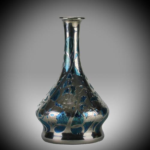 Very fine early 20th Century Austrian papillon glass vase of bulbous decanter shape by Johann Loetz overlaid with applied silver Art Nouveau fruiting grape vines decoration and everted neck with slivered rim