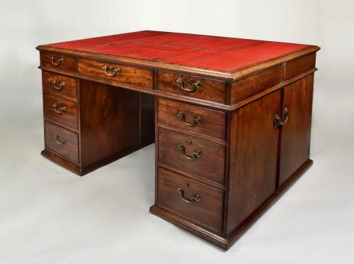 George III mahogany partner’s desk with original handles and an old red leather top, c.1780