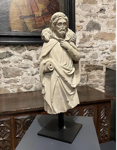 A TRULY STUNNING AND MUSEUM QUALITY ROMANESQUE SCULPTURE OF CHRIST AS THE GOOD SHEPHERD. FRENCH.CIRCA 1250.