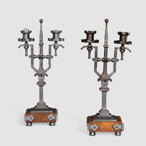 An Unusual Pair of English Aesthetic Style Steel and Walnut Two-Light Candelabra.  English, Circa 1880. 