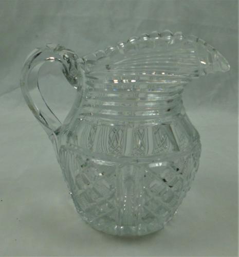 A Regency period crystal glass pint size jug, Anglo Irish circa 1810