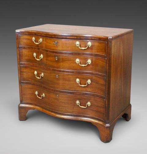 four drawer serpentine chest of drawers
