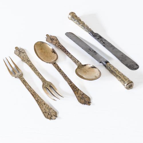 A 17th century set of pairs of forks, knives and spoons
