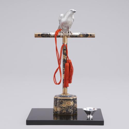 Japanese silver hawk on a black lacquer stand, signed Shoeido and marked Jungin late Meiji Period
