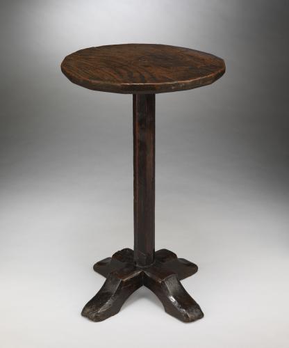 An Early Sculptural Vernacular Candlestand The Multiple Sided Top Raised on an Octagonal Stem and Cruciform Base Well Patinated Oak