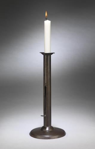 An Unusual Large "Hogscraper" Candlestick Of Traditional Form on Slightly Domed Bases Well Patinated Sheet Metal English, c. 1830