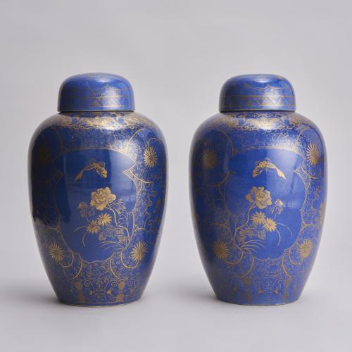 An attractive pair of 19th Century Chinese powder blue jars and covers