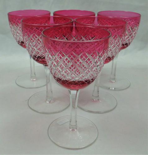 six cranberry over crystal wine glasses