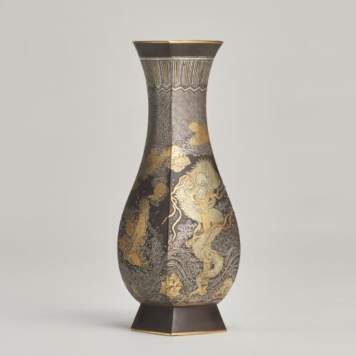 A beautiful Iron and multi-metal vase depicting Dragons and Shachi (Japanese, Circa 1880)