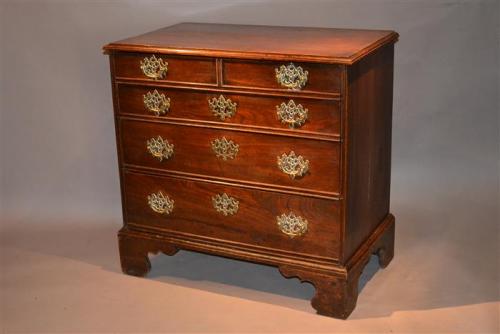 An elegant George II elm chest of drawers