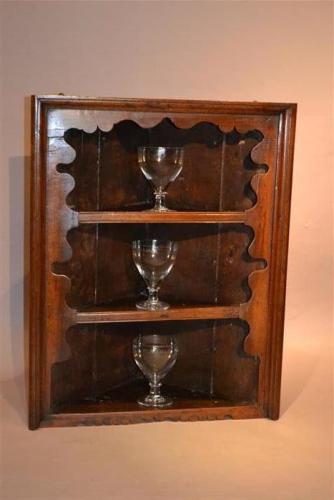 A George II fruitwood corner display cabinet