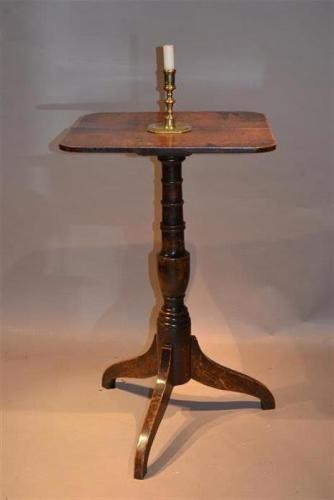 A small George III oak and elm pedestal table