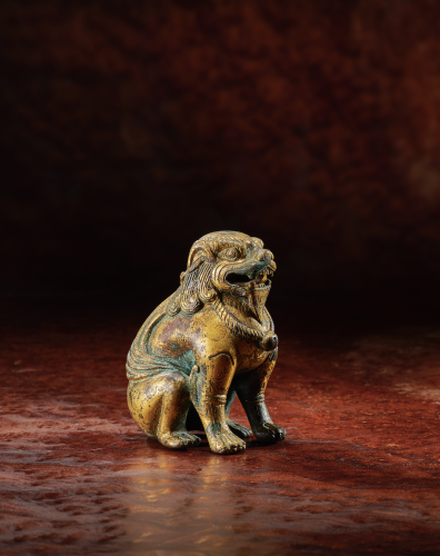 Gilt-bronze seated lion