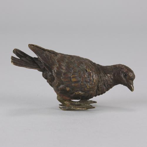 Early 20th Century cold-painted Vienna bronze entitled  "Feeding Pigeon"