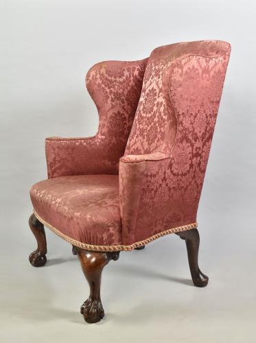 George II mahogany cabriole leg wing chair on claw and ball feet, c.1750