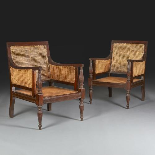 A Pair of Anglo Indian Regency Style Caned Bergeres