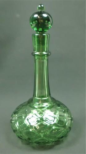 Green glass honeycomb moulded shaft and globe decanter, English circa 1860