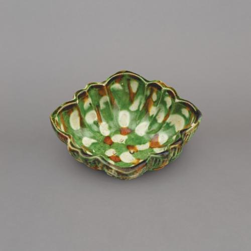Chinese pottery sancai, three-colour glazed quatrefoil moulded cup, bei, Tang dynasty, Gongxian kilns, Henan Province, 7th – 8th century.