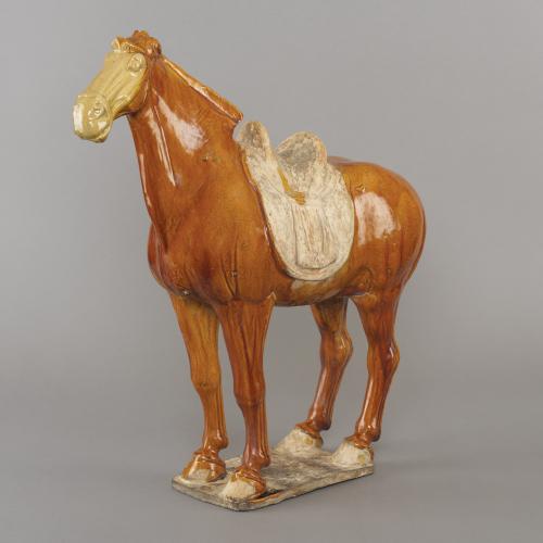 Chinese pottery amber glazed standing horse, Tang dynasty, 8th century.