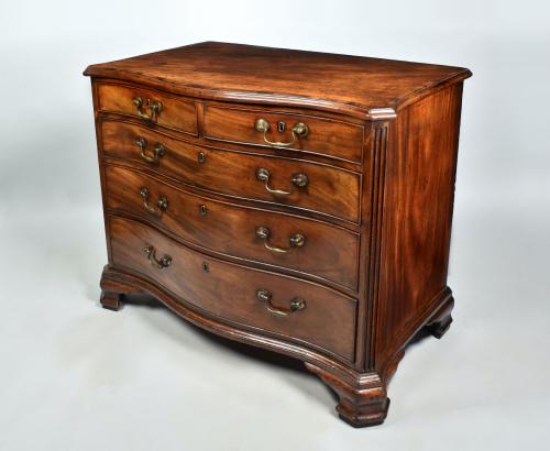George III mahogany serpentine chest of drawers with crossbanded top, original handles and ogee feet, c.1770