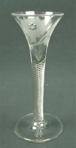 A drawn trumpet shaped air twist wine glass engraved with Jacobite symbols, English circa 1750.