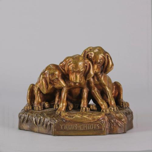 Animalier bronze sculpture entitled "Trois Chiots" by Georges Vacossin Circa 1900
