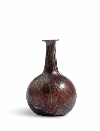 A Roman aubergine and white 'marbled' glass bottle