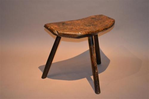 Primitive ash three legged stool