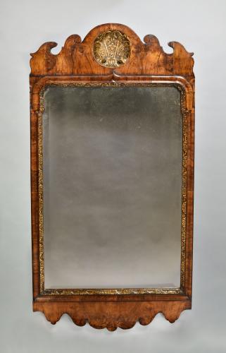George I walnut and parcel gilt mirror, c.1720