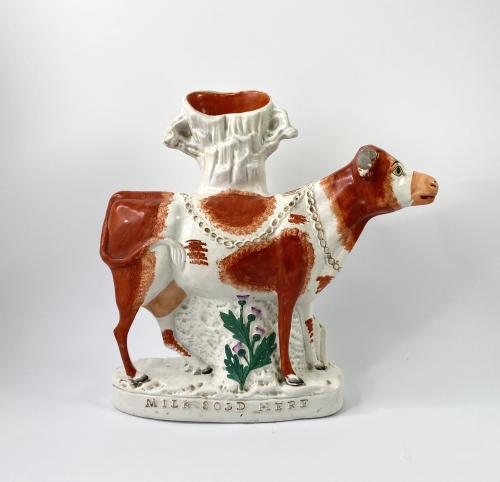 Staffordshire pottery cow spill vase